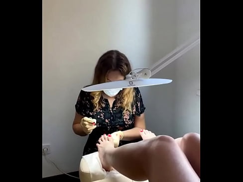 Russian sexy young woman with long slender legs came for a pedicure